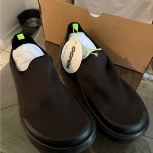 OOFOS Black Slip-On Shoes with Neon Green Accent